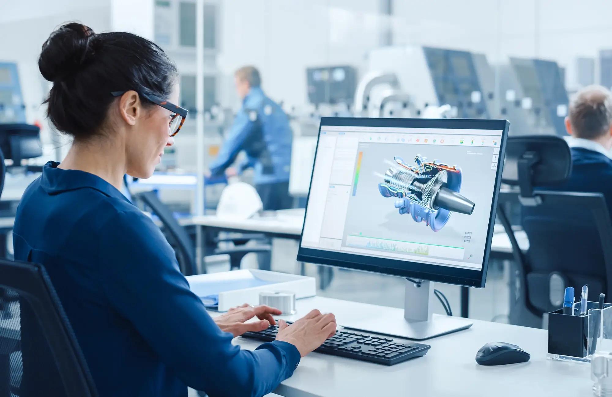 Woman working on a computer and benefiting from custom packaging solutions.