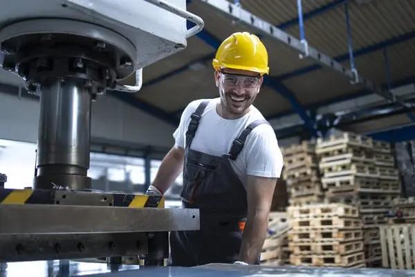 Man working on industrial equipment.