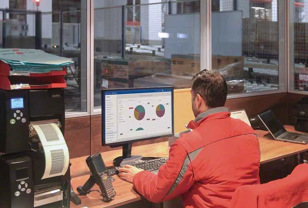 Man analyzing the custom reporting dashboard for the supply chain.